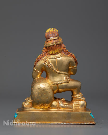 Black Dzambhala holding skull cup and treasure spitting mongoose.