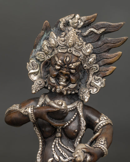 Black Dzambhala Statue close-up, flaming halo lotus pedestal, oxidized copper, handmade Nepal