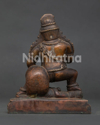 Black Dzambhala Statue handcrafted by Newari artisans from Patan Nepal with antique copper finish.