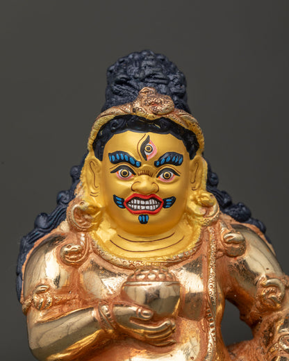 Black dzambhala wealth deity statue with 24k gold painted face and intricate copper craftsmanship.