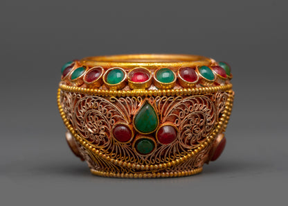 Back view of copper Tibetan Golpa bowl showing gold-plated symbolic patterns