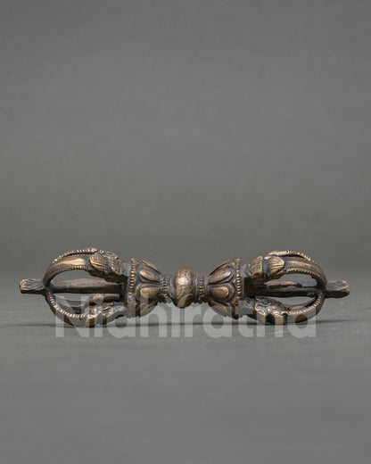 Bronze Vajra Dorje with intricate patterns for traditional Vajrayana Buddhist rituals