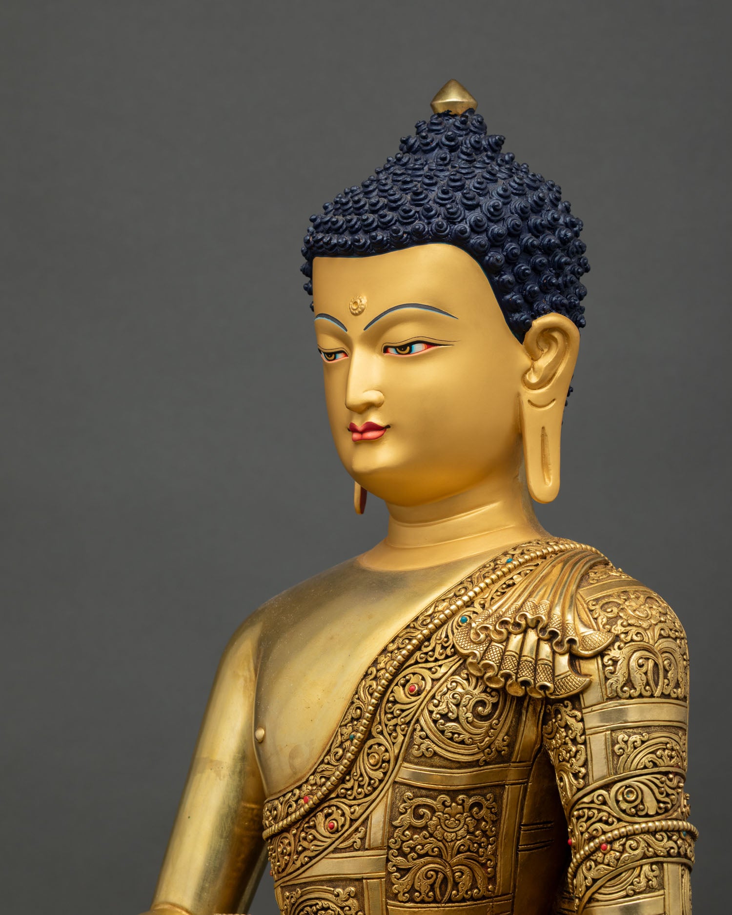Buddha head side angle, peaceful meditation face, hand-chiseled features garments