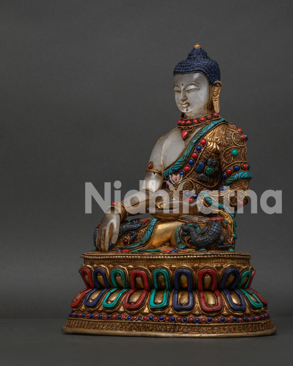 Buddha Shakyamuni sculpture with crystal bowl and intricate gold gilded details