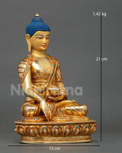 Buddha Shakyamuni seated in meditation on a lotus throne holding a patra bowl