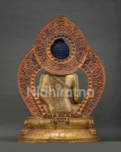 Buddha Shakyamuni Statue back view showing monastic robes and ornate backdrop design