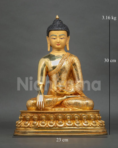 Buddha Shakyamuni Statue, handcrafted in Nepal, with 24K gold fire-gilding, a serene gold-painted face, and a lotus pedestal.