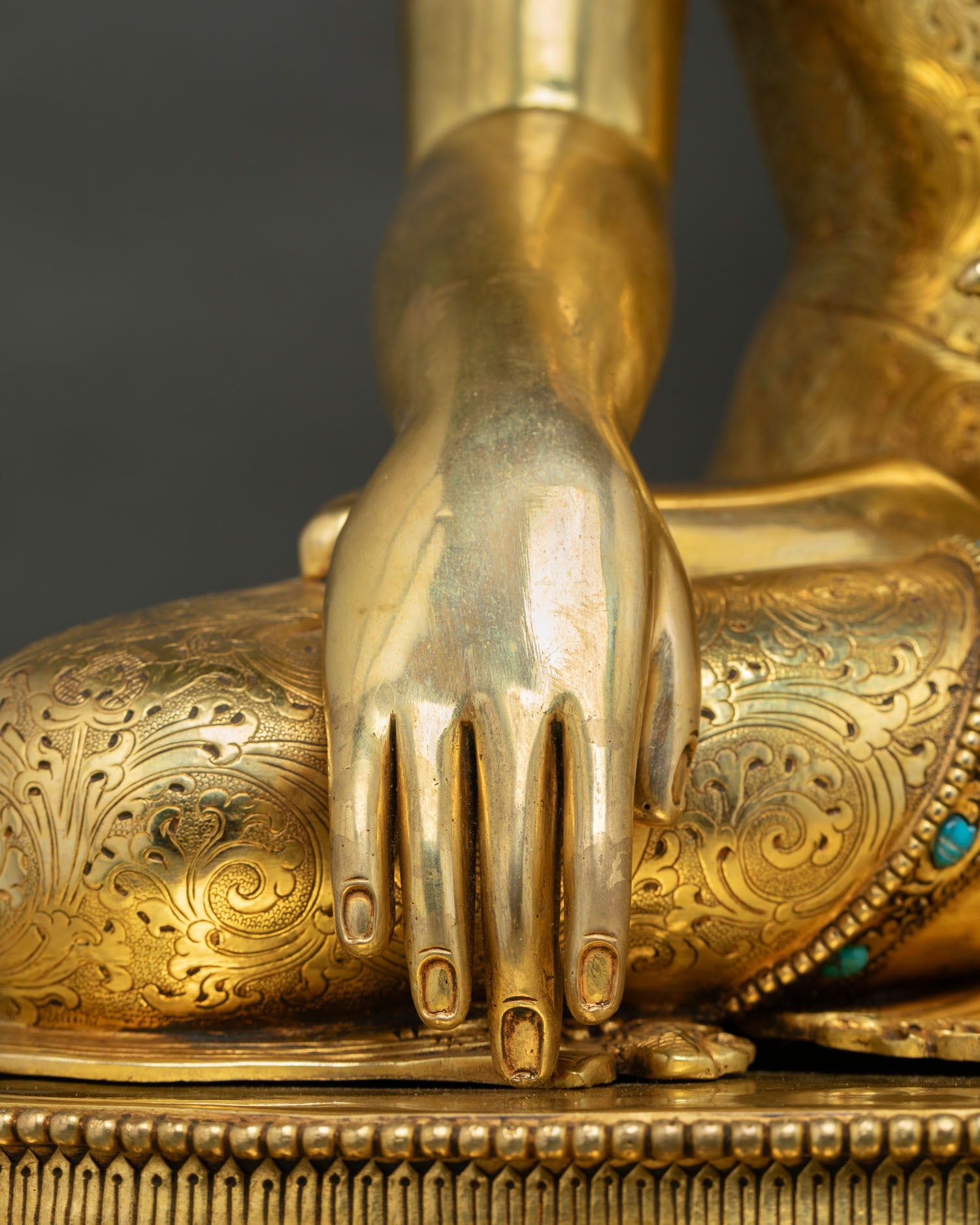 Buddha Shakyamuni Statue hands detail showing bhumisparsa mudra close-up