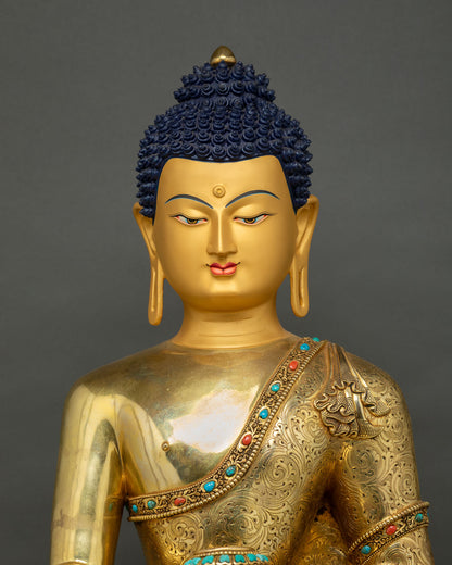 Buddha Shakyamuni Statue head close-up showing blue curled hair and serene face profile