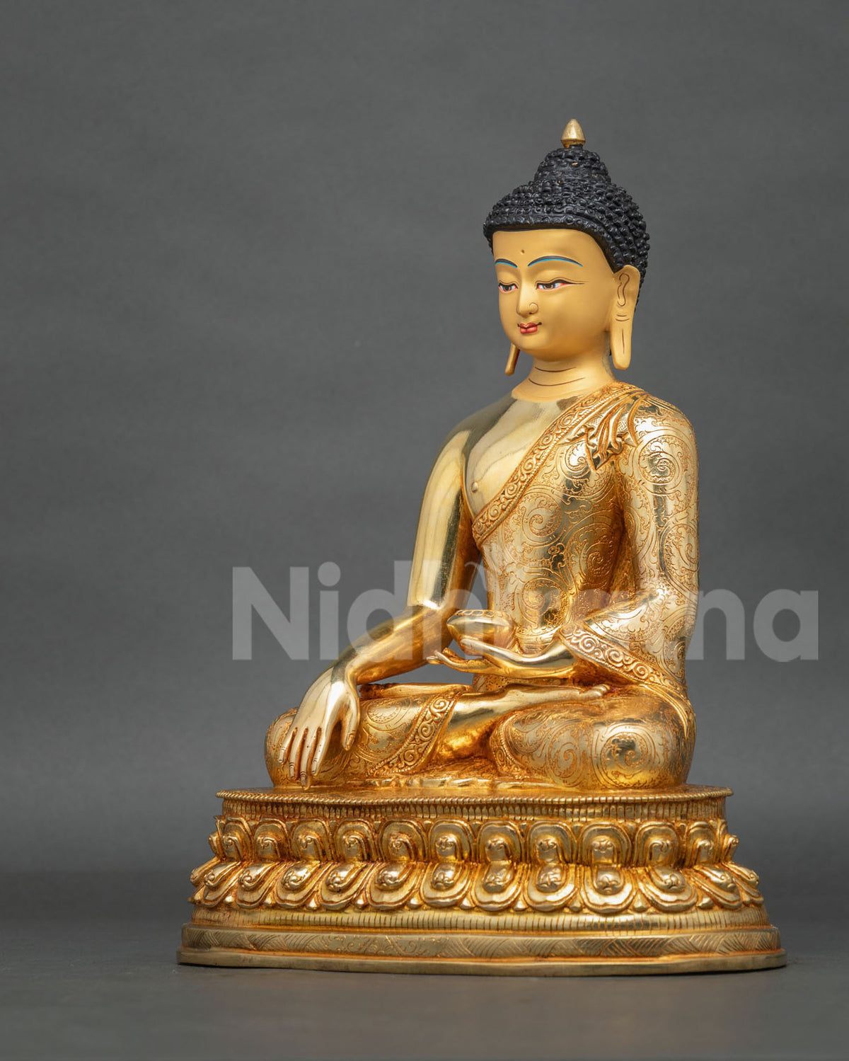 Buddha Shakyamuni Statue seated in vajra posture on a lotus pedestal, symbolizing enlightenment, wisdom, compassion, and inner peace.