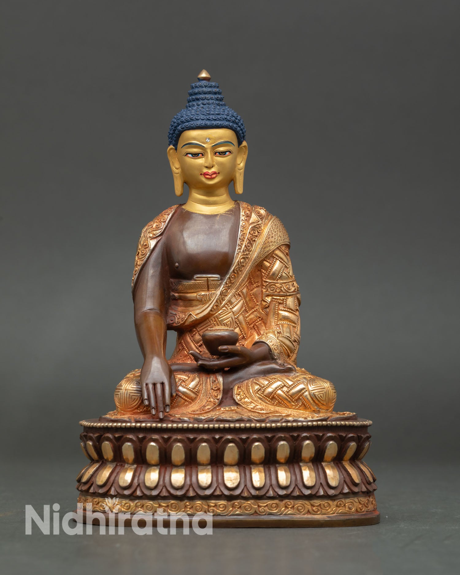 Buddha statue in oxidized copper with 24K gold fire-gilded robes, handmade in Nepal, sacred meditation altar decor.