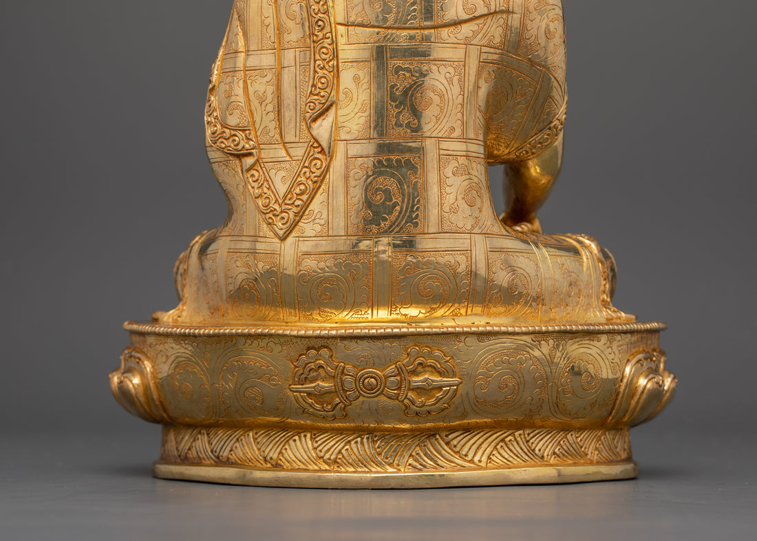 the lower back side of gold plated buddha statue