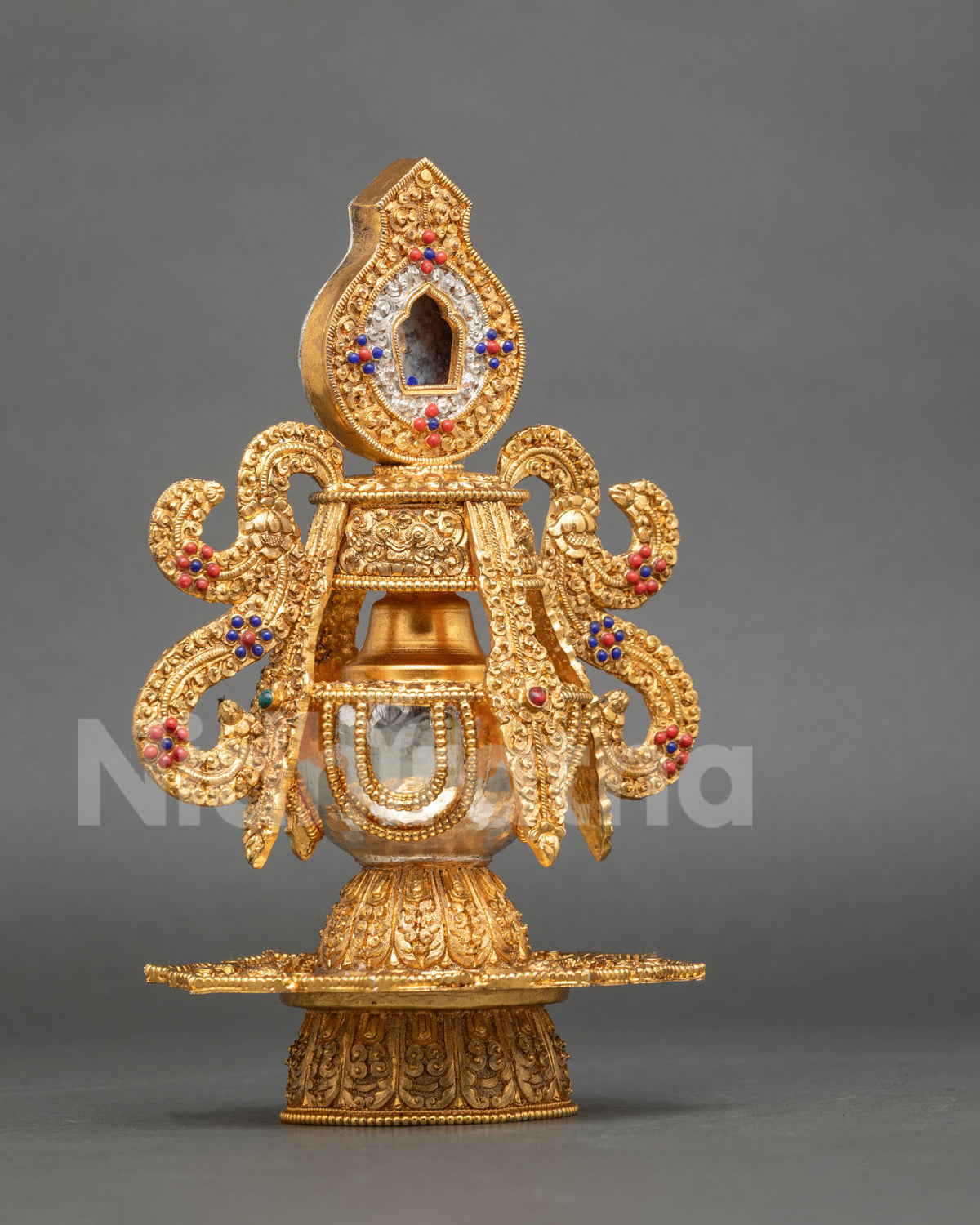 Buddhist Che Bumba vessel adorned with semi-precious coral and lapis lazuli stones