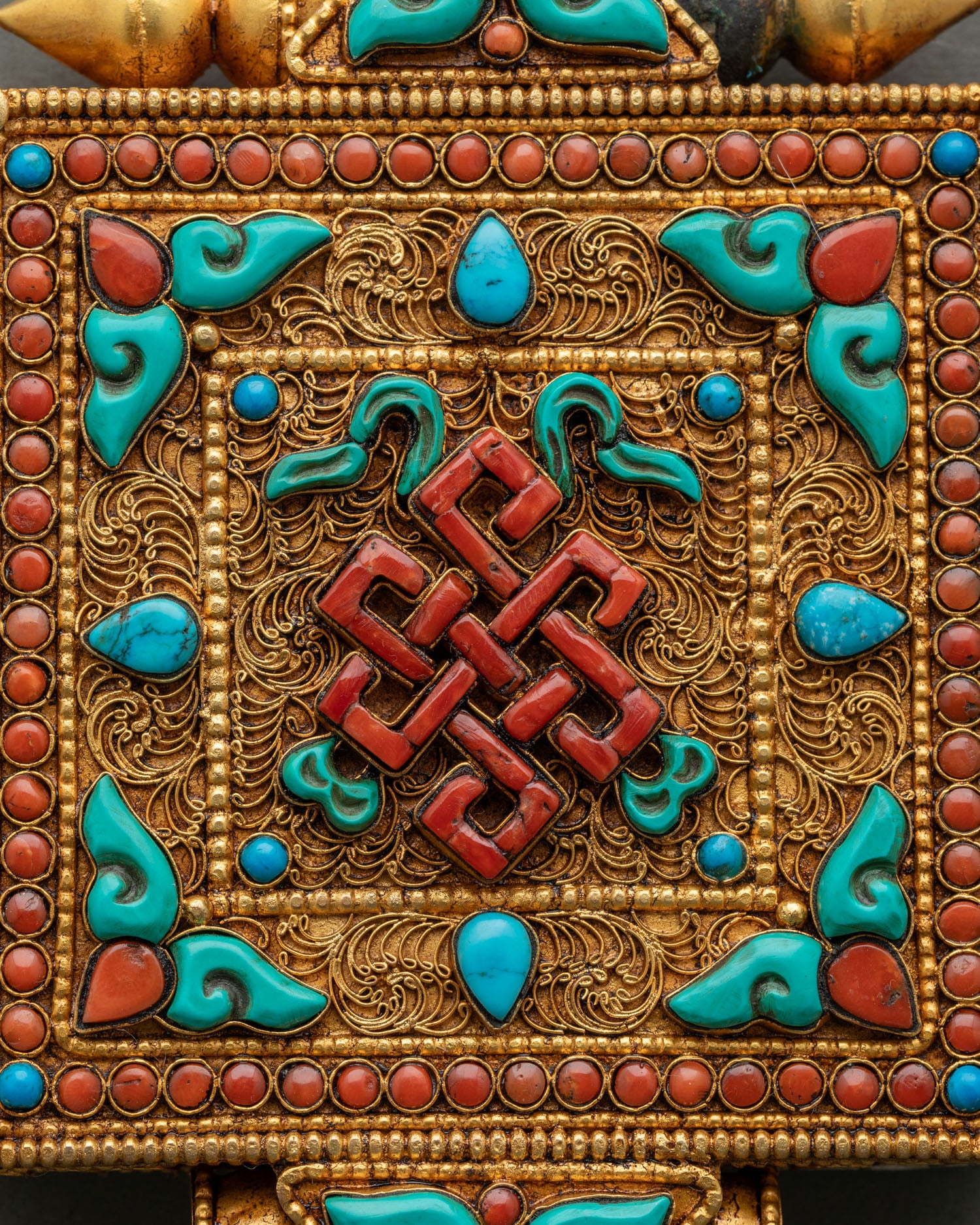 Buddhist Endless Knot Ghau Amulet with turquoise coral and filigree artwork