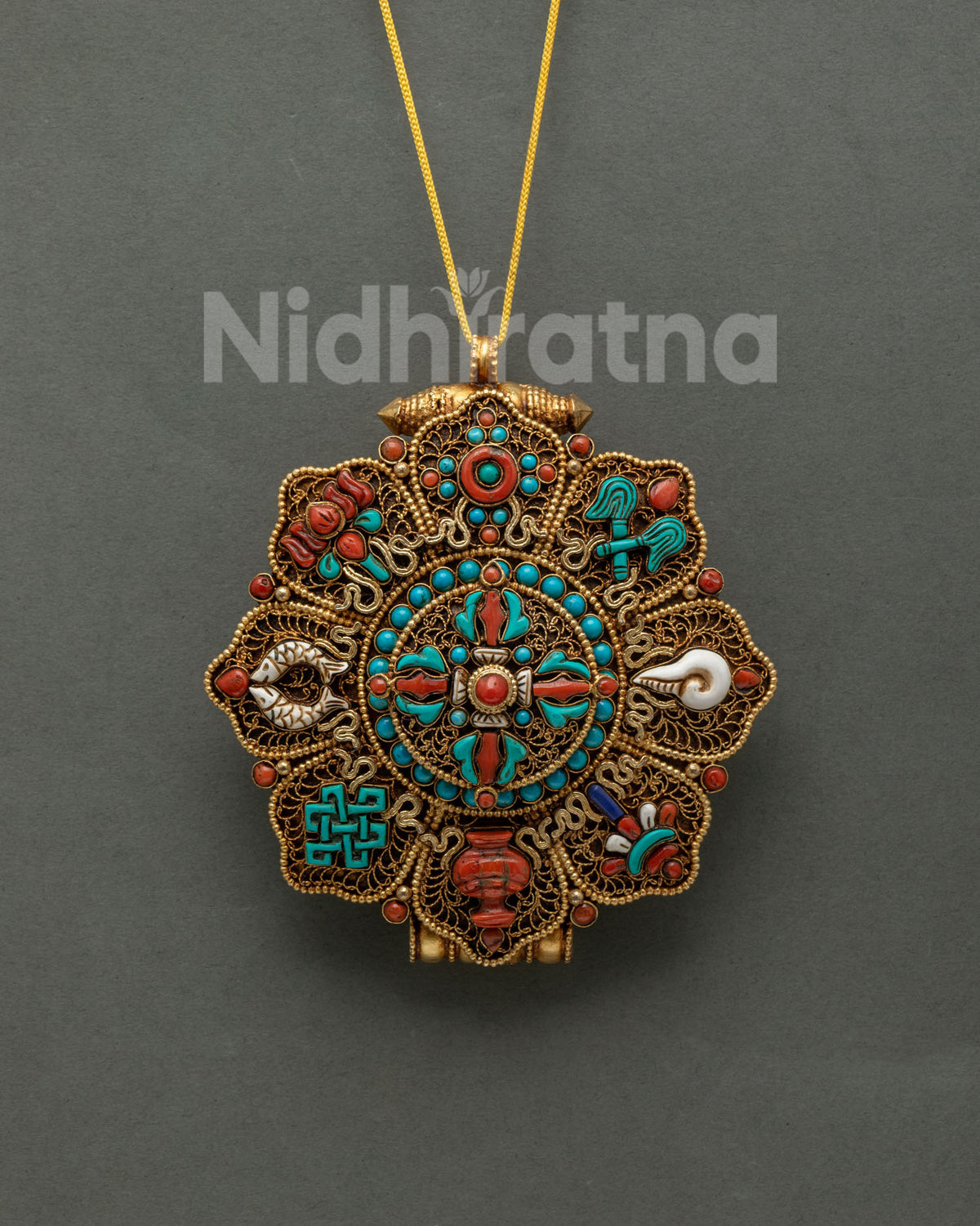 Buddhist Ghau Mala pendant front view with gold-gilded filigree, turquoise and coral, handmade in Nepal