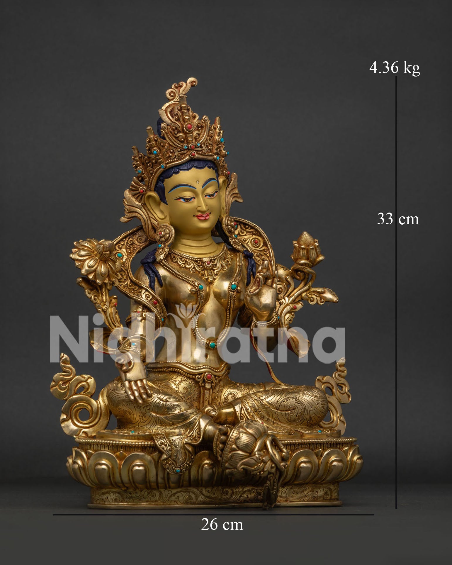 Buddhist Green Tara deity statue with extended leg resting on lotus flower