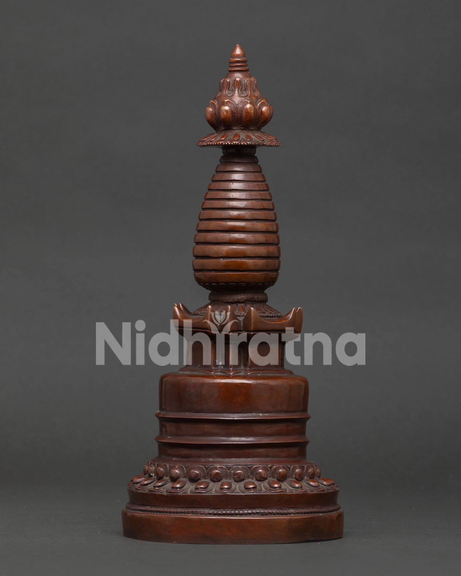 Buddhist Kadampa Stupa featuring double lotus base and stepped harmika details