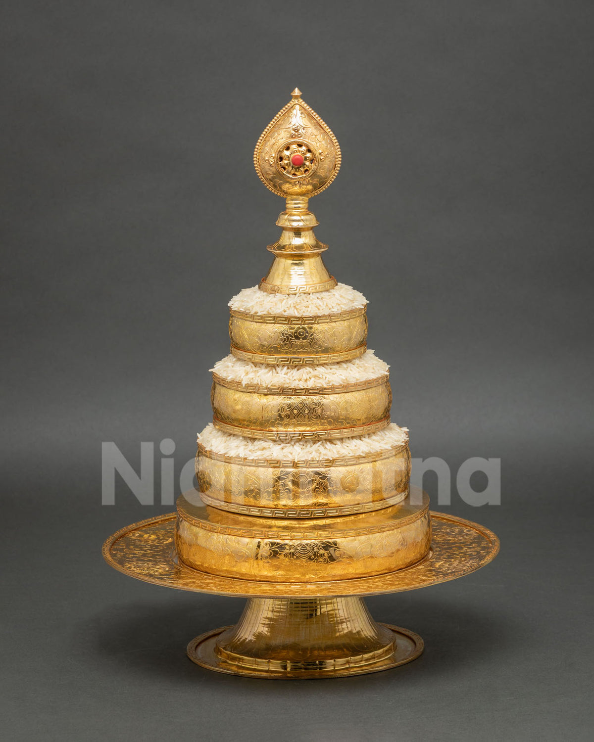 Buddhist mandala offering set with coral stone norbu finial and traditional Himalayan craftsmanship
