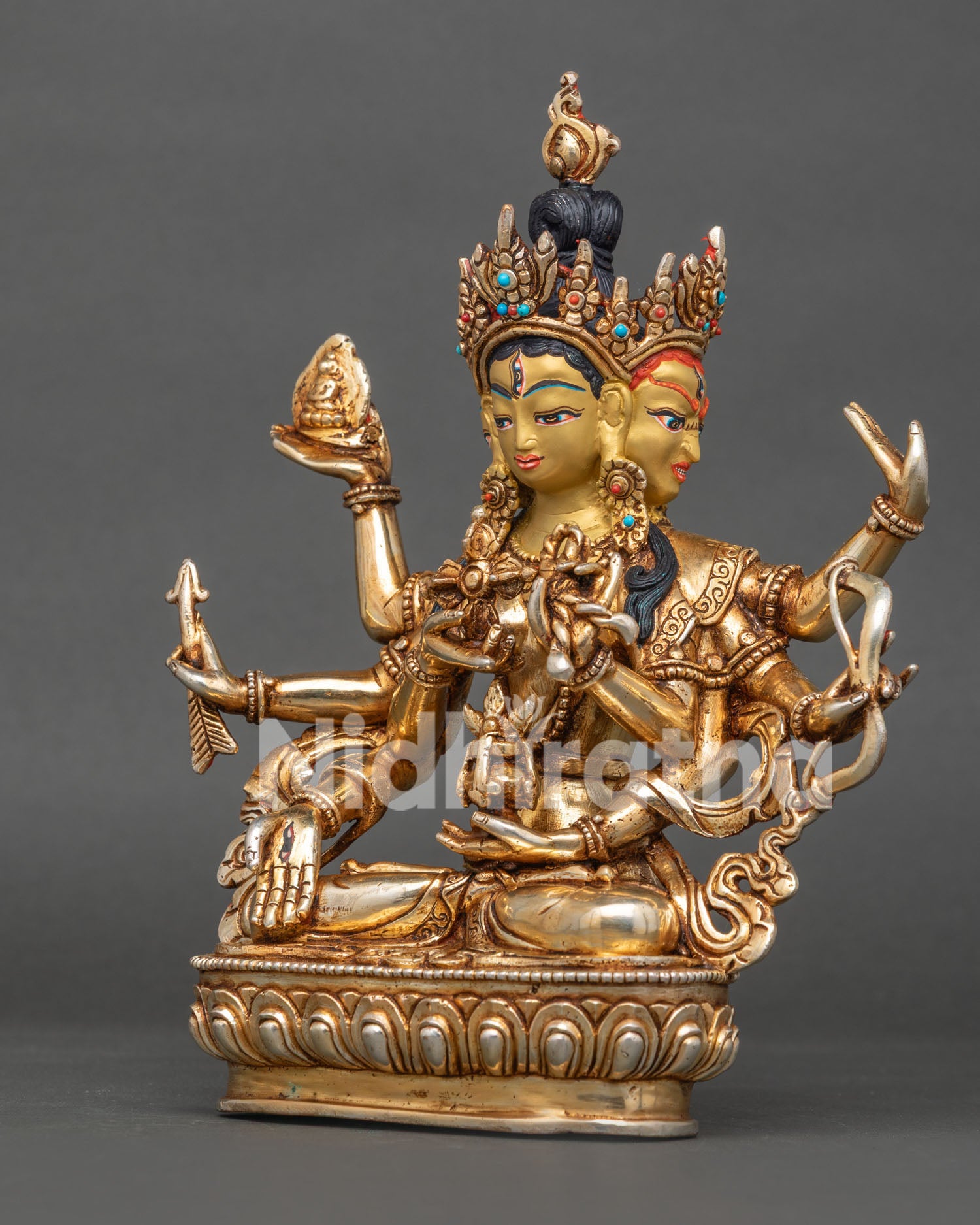 Buddhist Namgyalma deity statue showing six hands with bow arrow Buddha and lasso attributes.