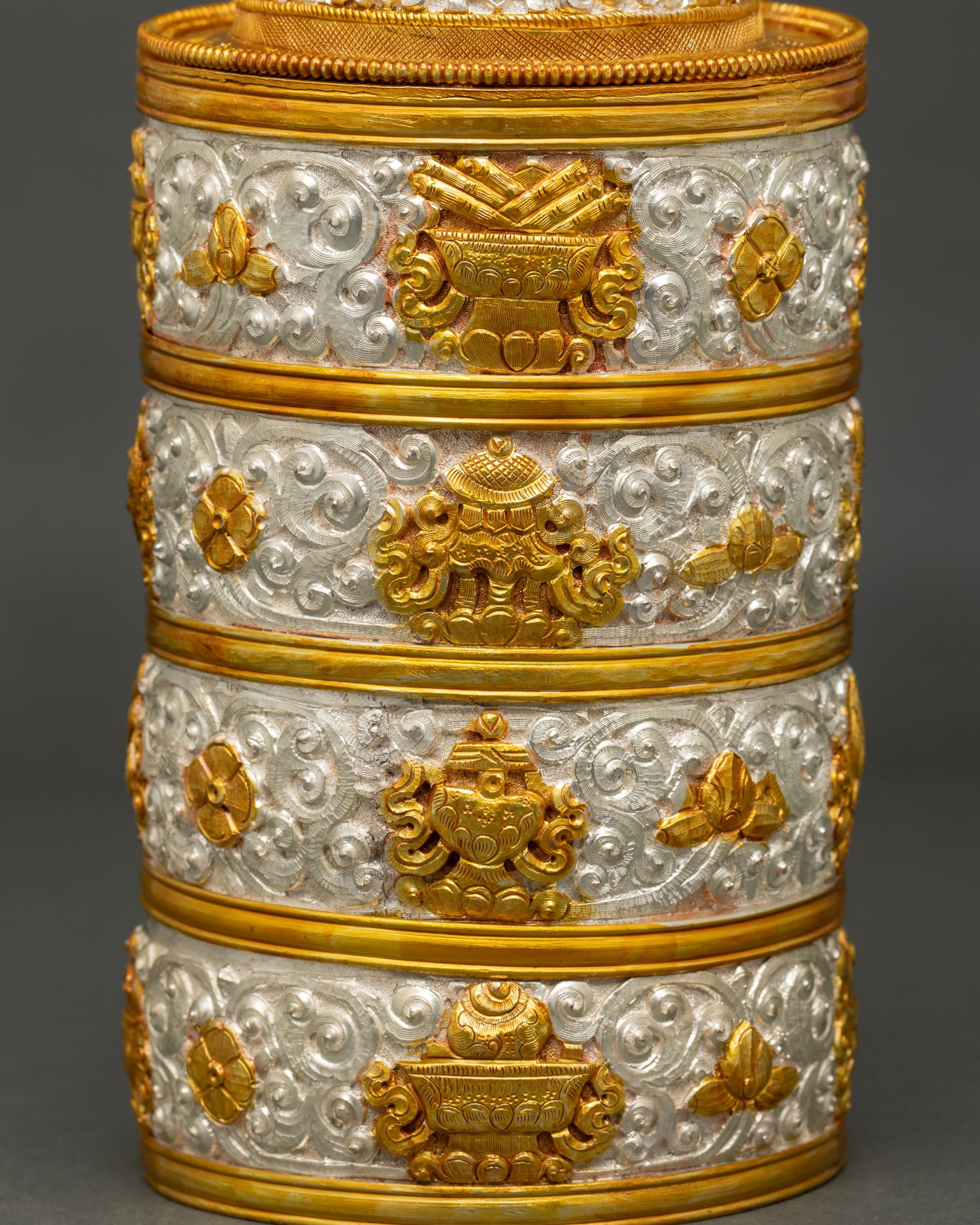 Buddhist ritual rice pot featuring floral carvings and gold silver plated copper