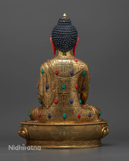 Buddhist Shakyamuni statue with ornate floral carvings and radiant gold finish symbolizing wisdom compassion and enlightenment.