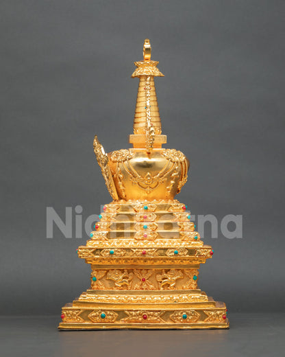 Buddhist Stupa sculpture adorned with semi-precious stones and intricate traditional metalwork