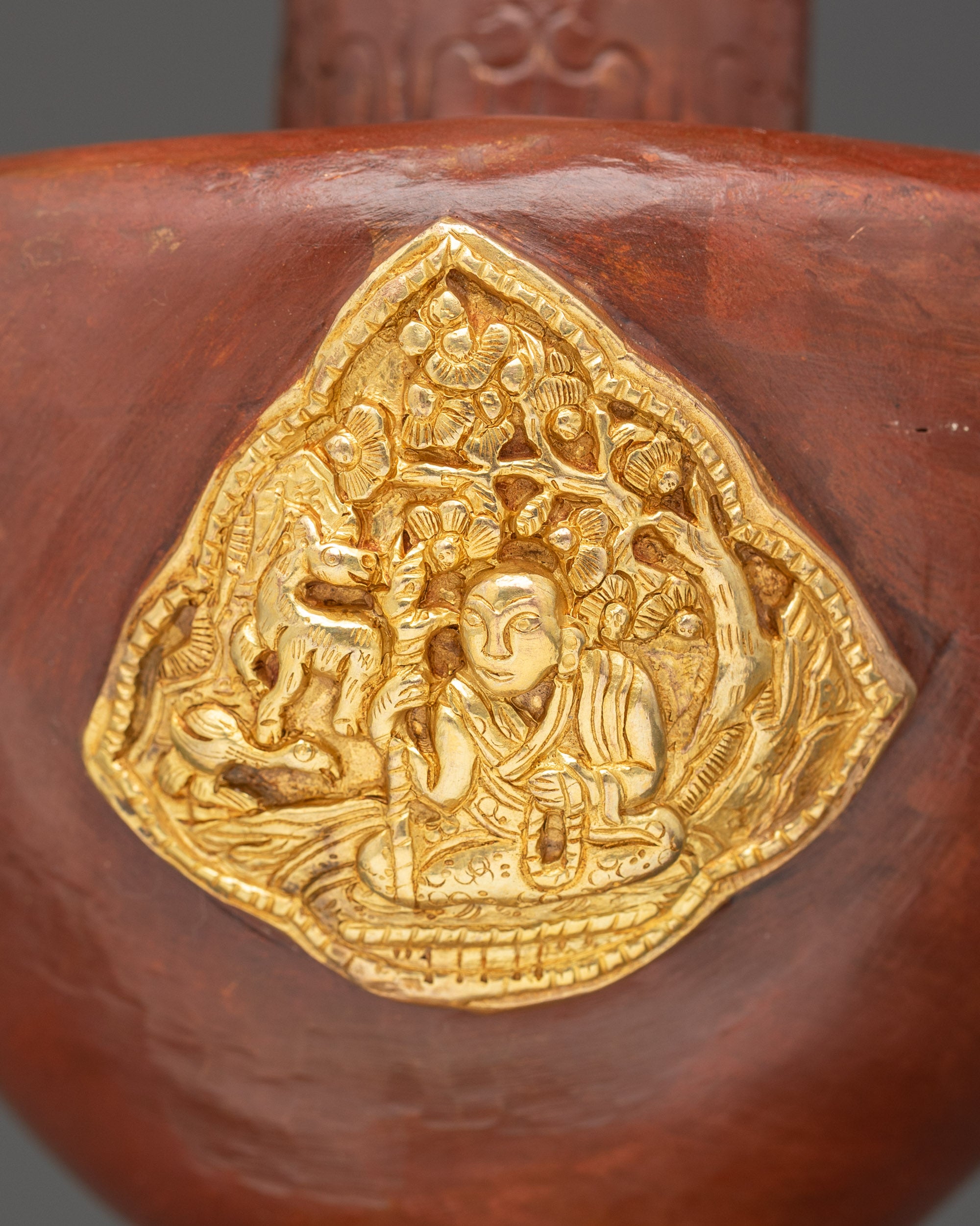 bumba with embossed auspicious symbols and sacred animal motifs