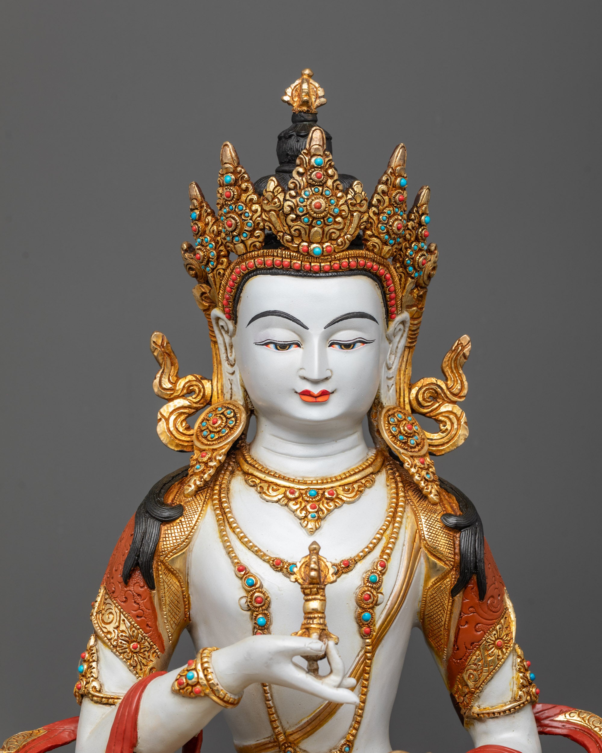 Close-up of Vajrasattva Statue showing intricate carvings and semi-precious stones on garments