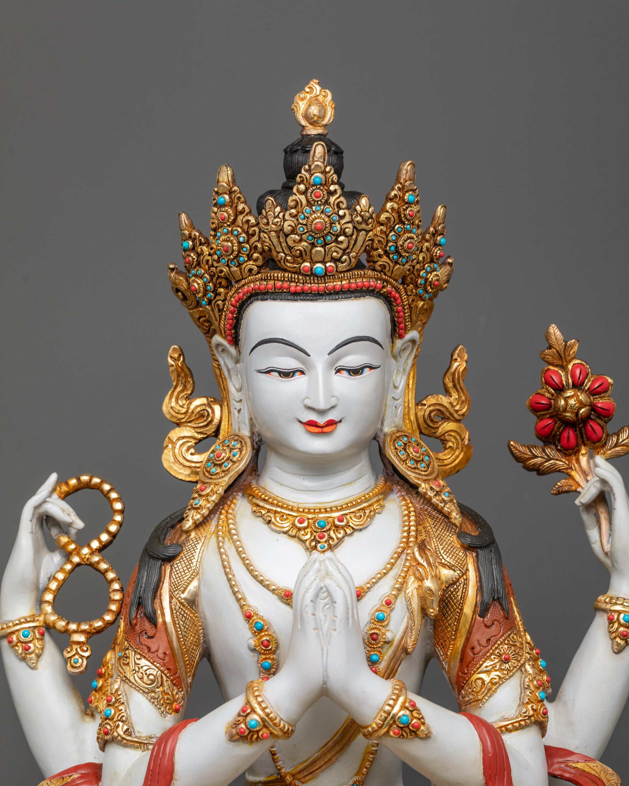 Close-up of Chenrezig Statue showing five-jewel crown and semi-precious stones
