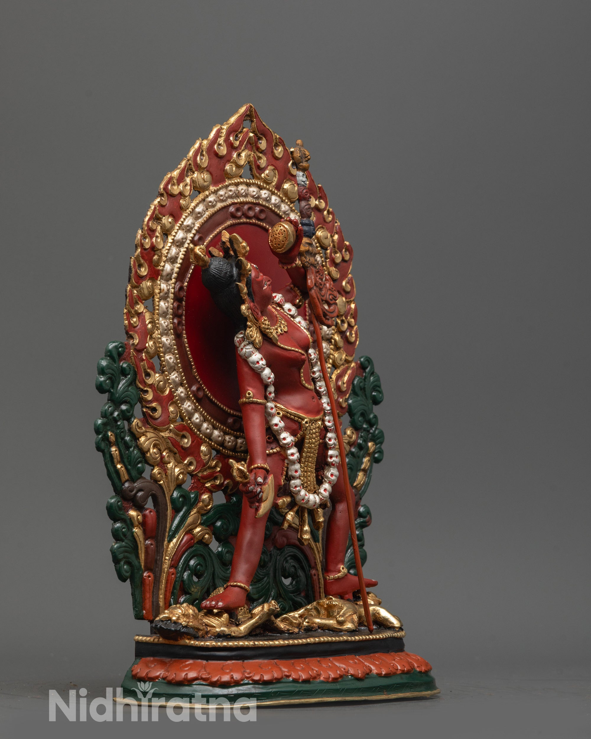 Side view of Himalayan Vajrayogini Statue holding kartaika knife and skull cup in hand