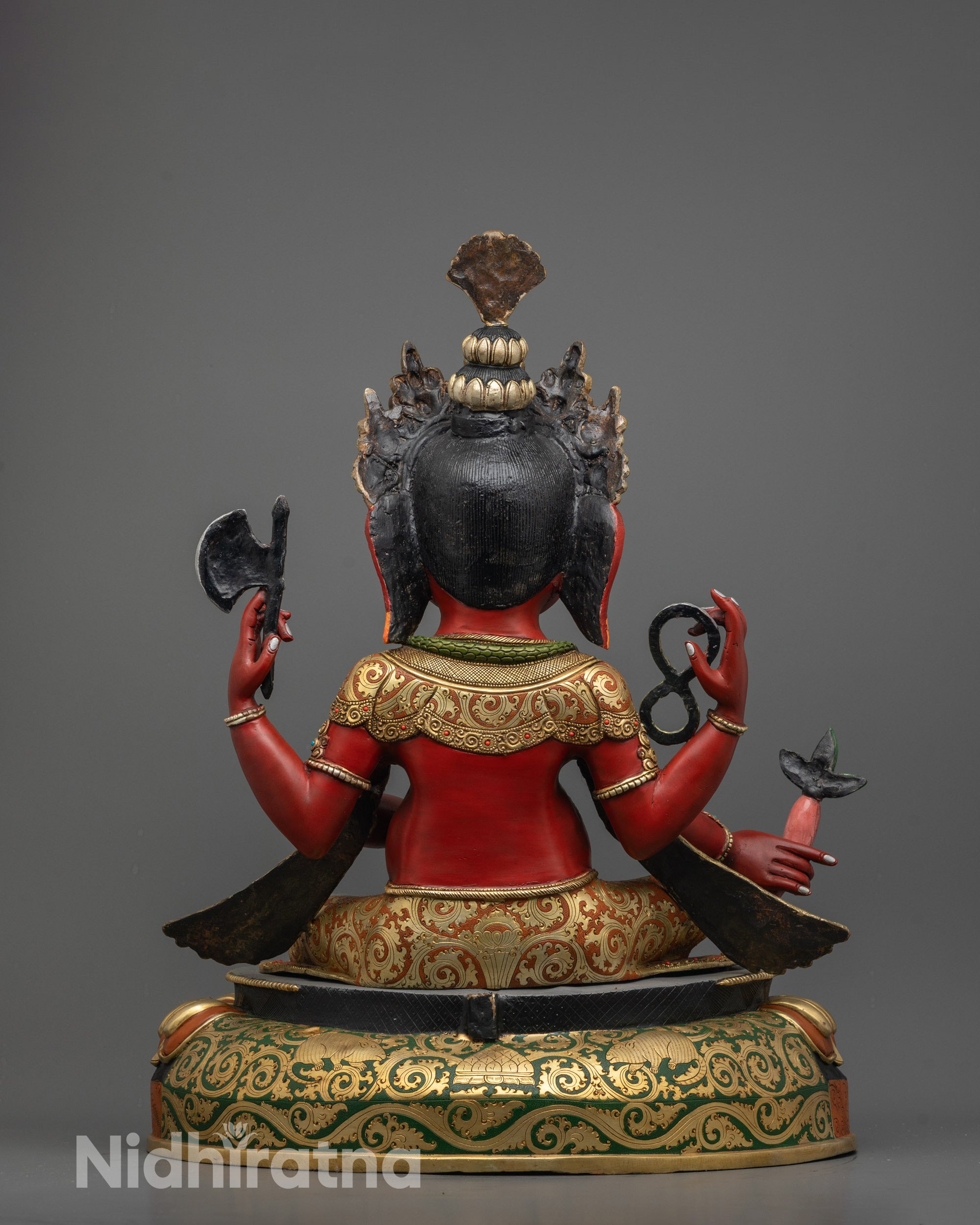Back view of Himalayan handcrafted Ganesh statue highlighting crown and detailed painting