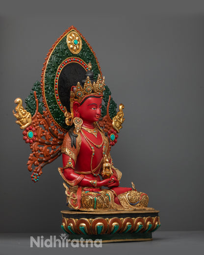 Side view of Red Hued Amitayus Statue displaying garments, intricate carvings, and halo