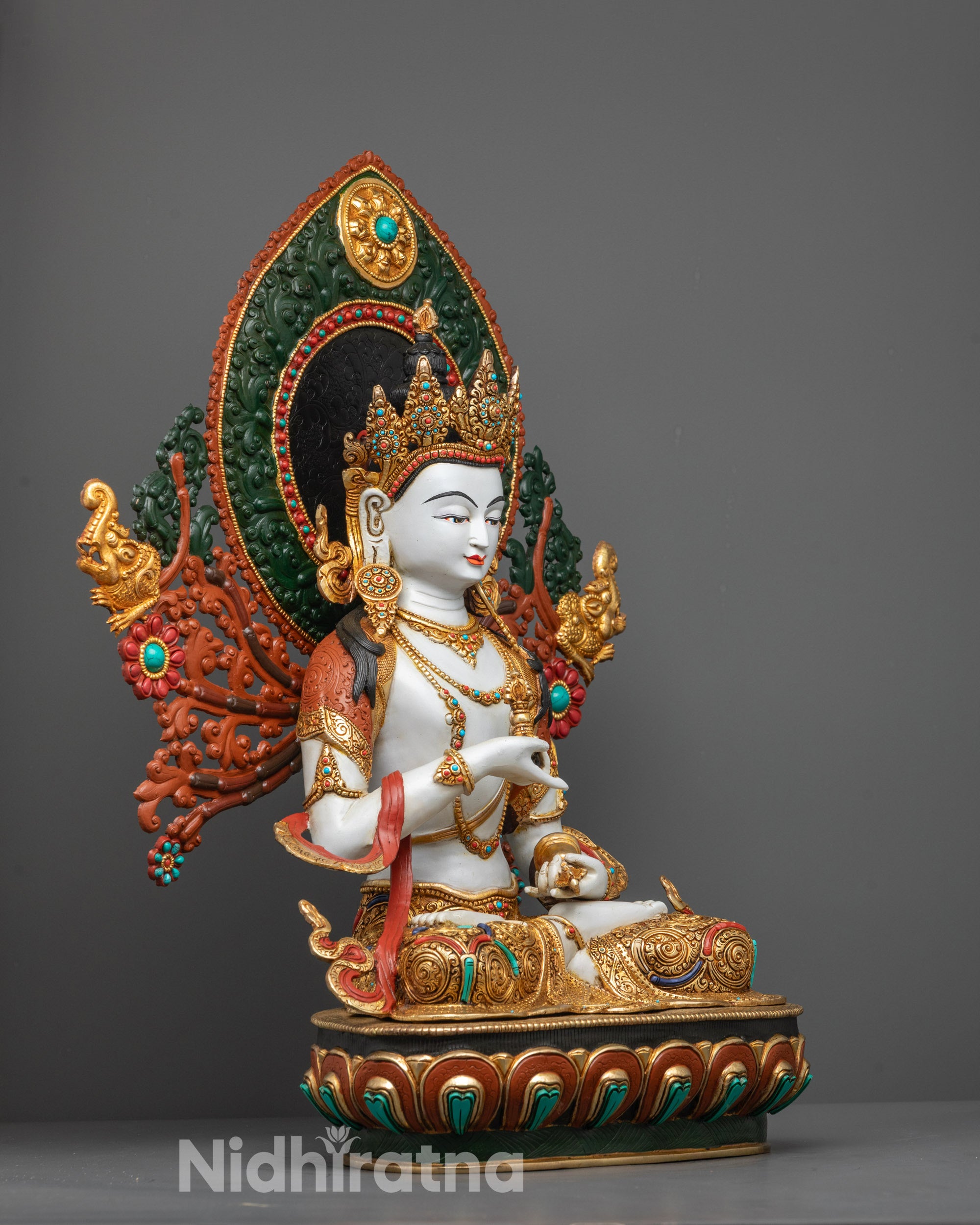 Side view of Vajrasattva Statue holding vajra and bell on gold-plated lotus seat