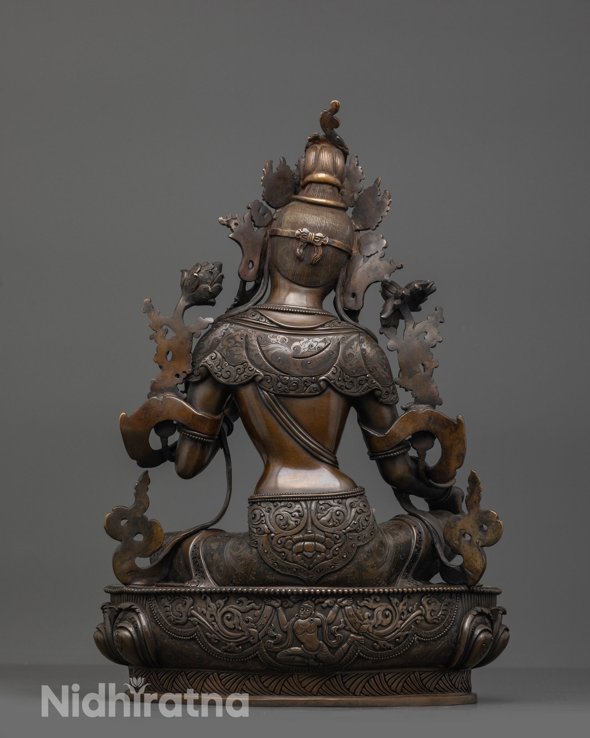 Back view of Oxidized Green Tara Statue highlighting carved lotus seat and oxidized copper finish