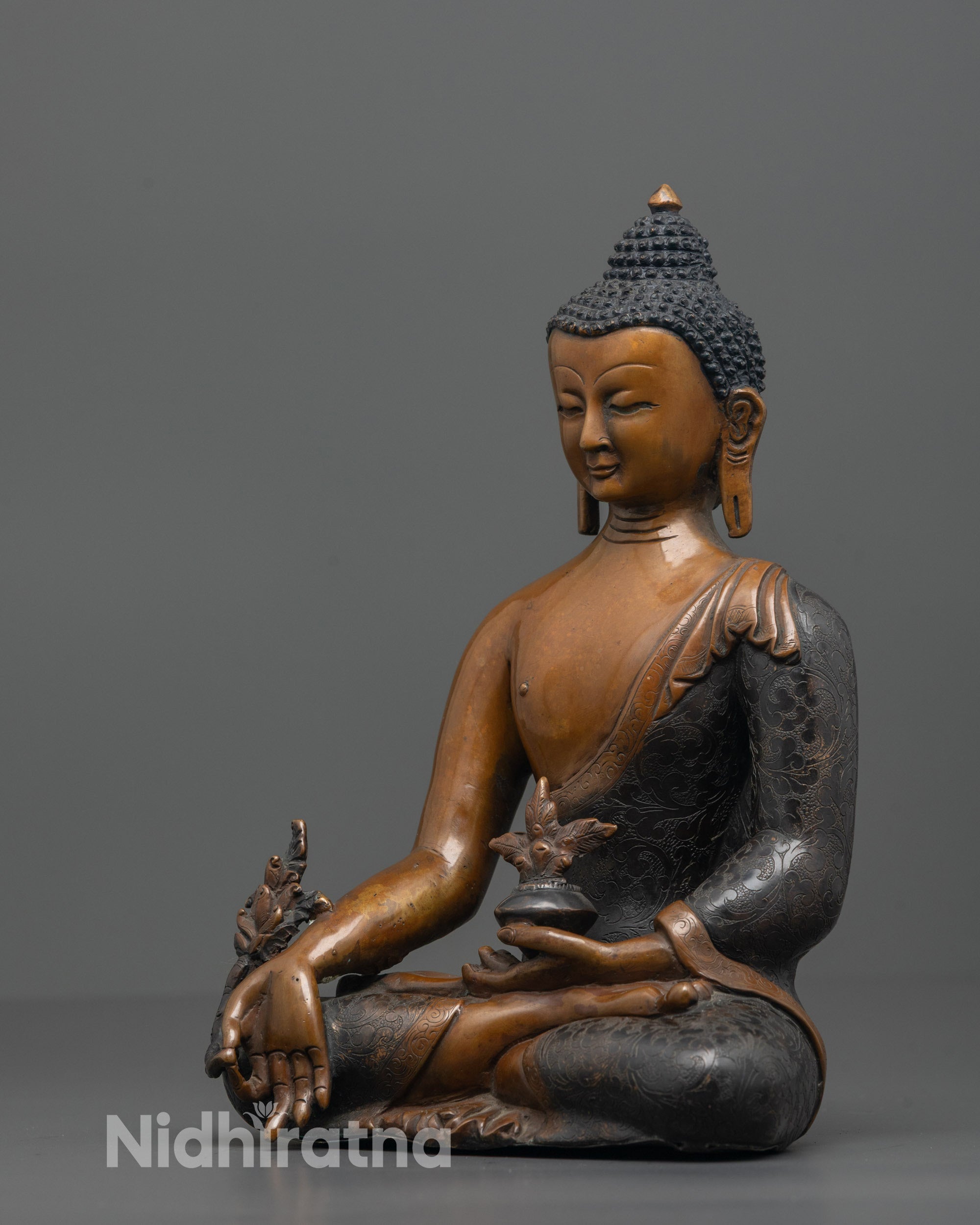 Detailed shot of Medicine Buddha’s serene face and sacred myrobalan fruit bowl