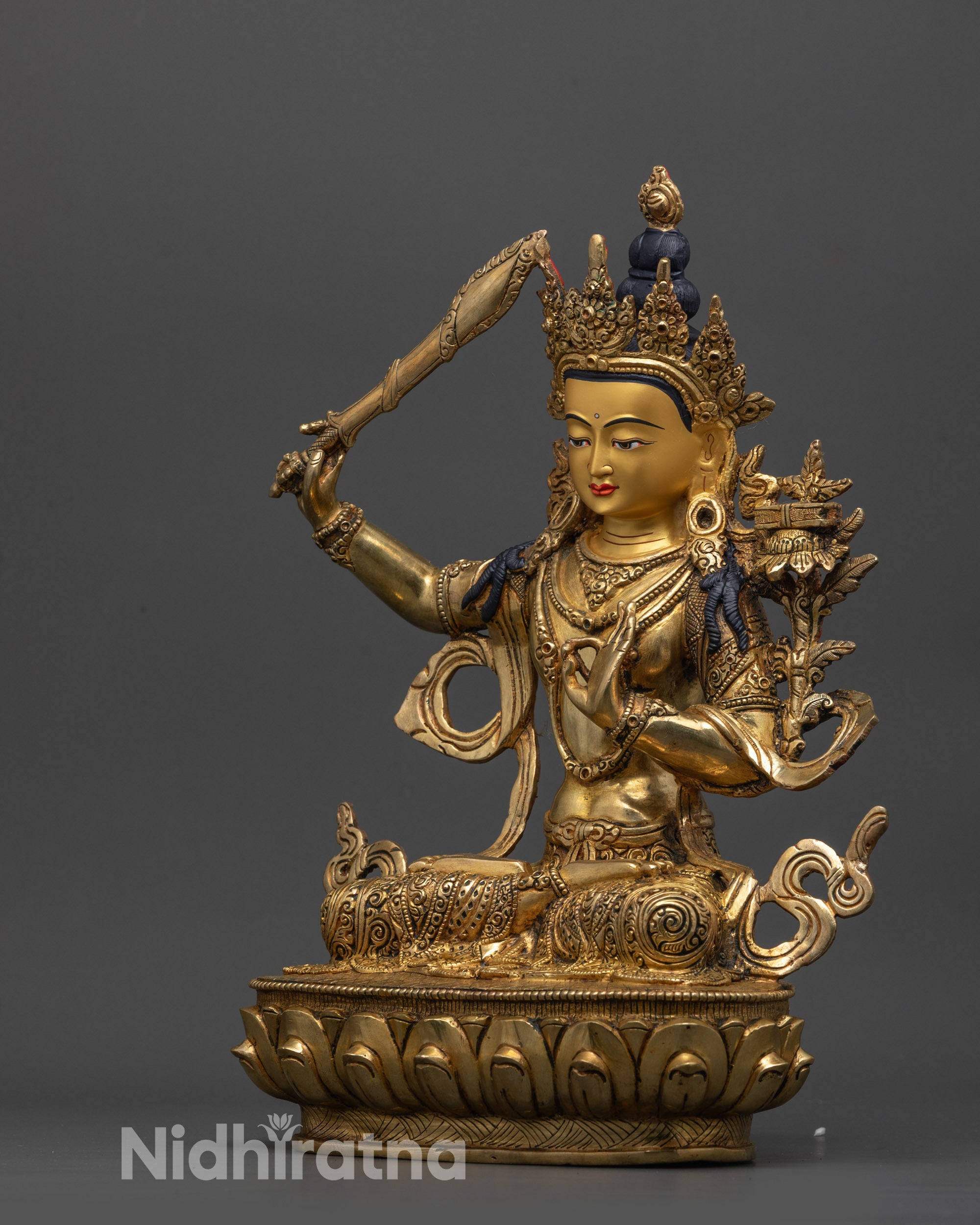 Side view of Monju Bosatsu statue holding Prajnaparamita Sutra on utpala flower
