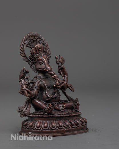 Side angle of Lord Ganesha idol with serpent mala and carved sacred elements