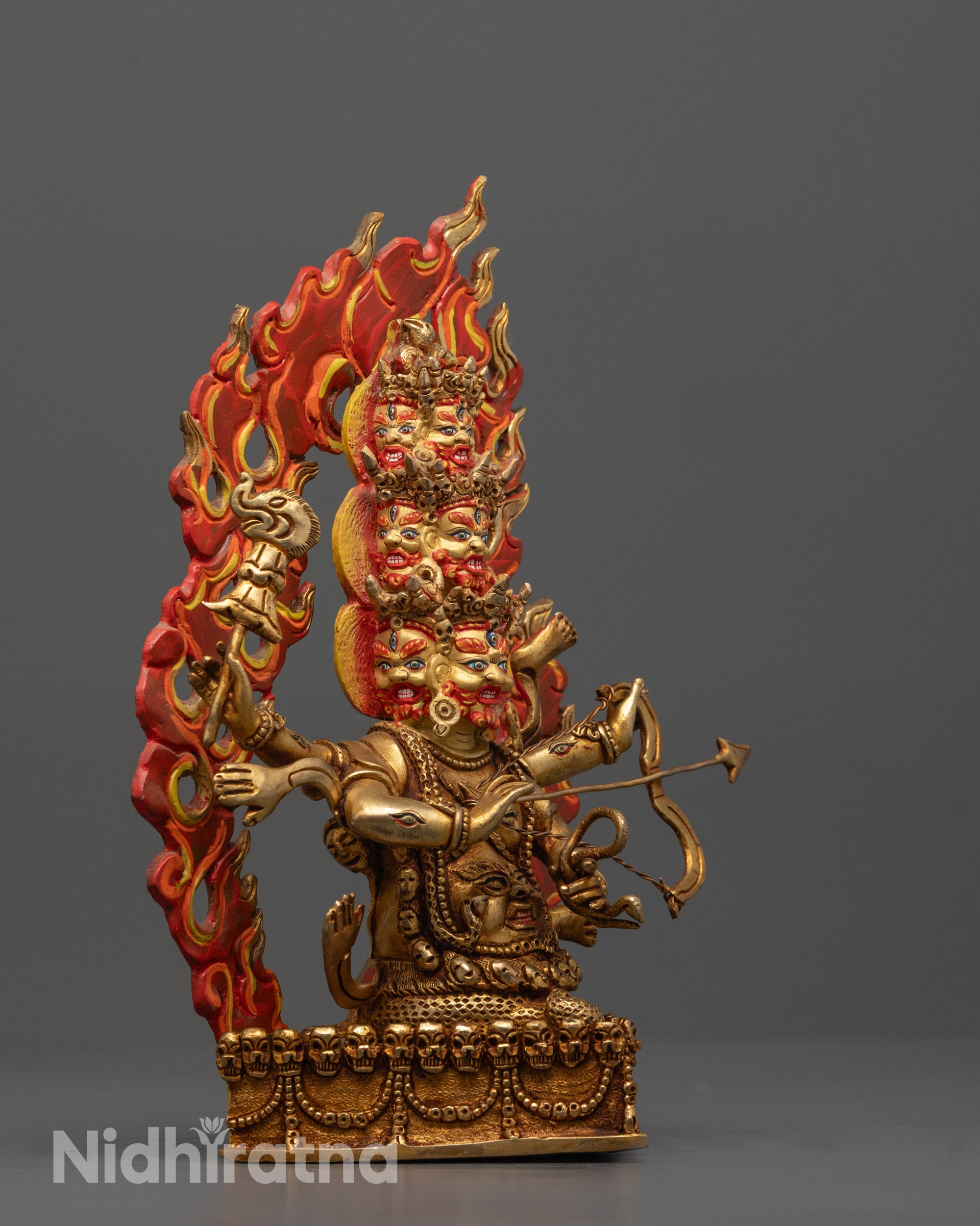 Side Angle of Rahula Statue Seated in Fierce Posture on Copper Base