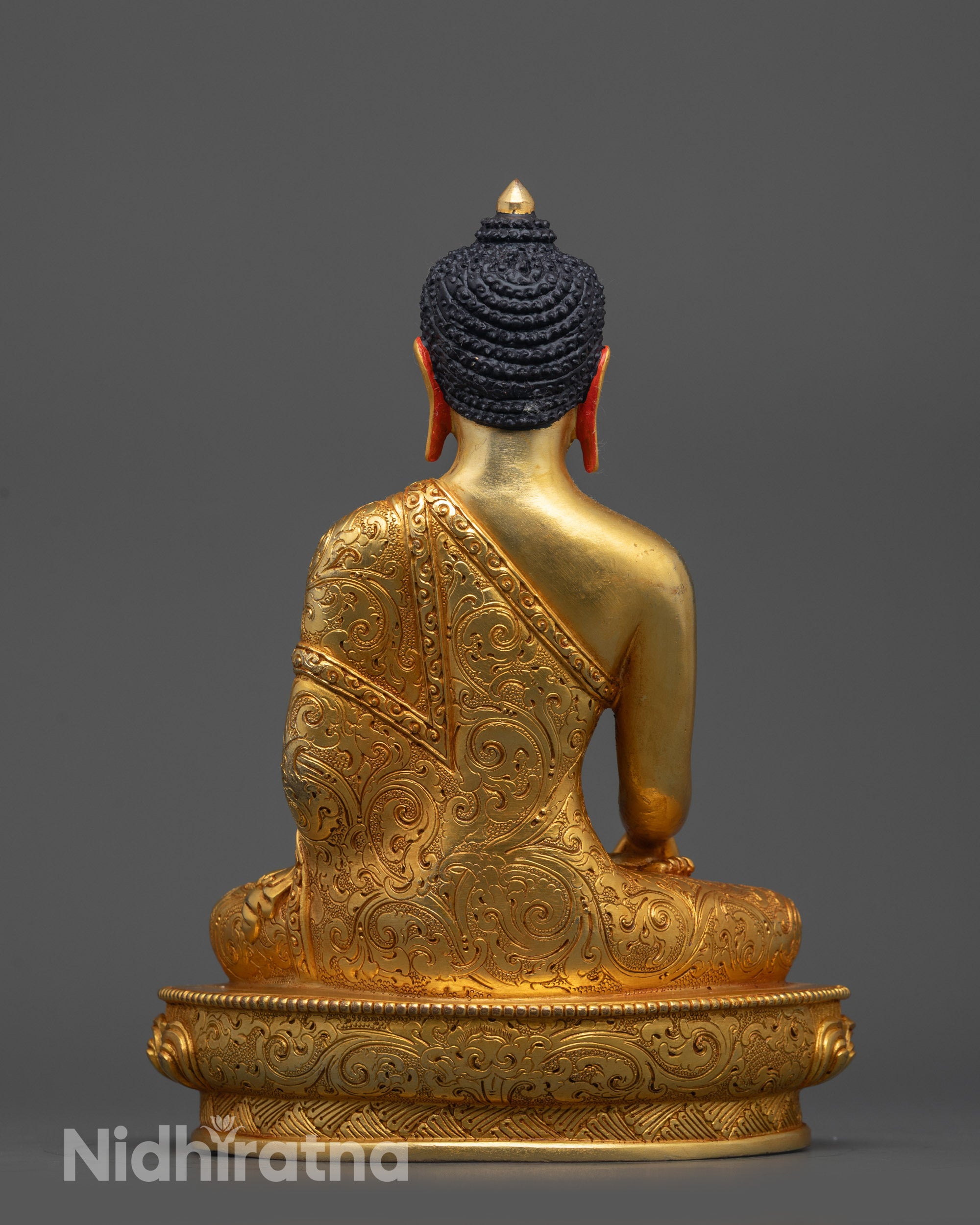 Back view of Buddha Statue displaying detailed carvings and radiant gold fire-gilded finish