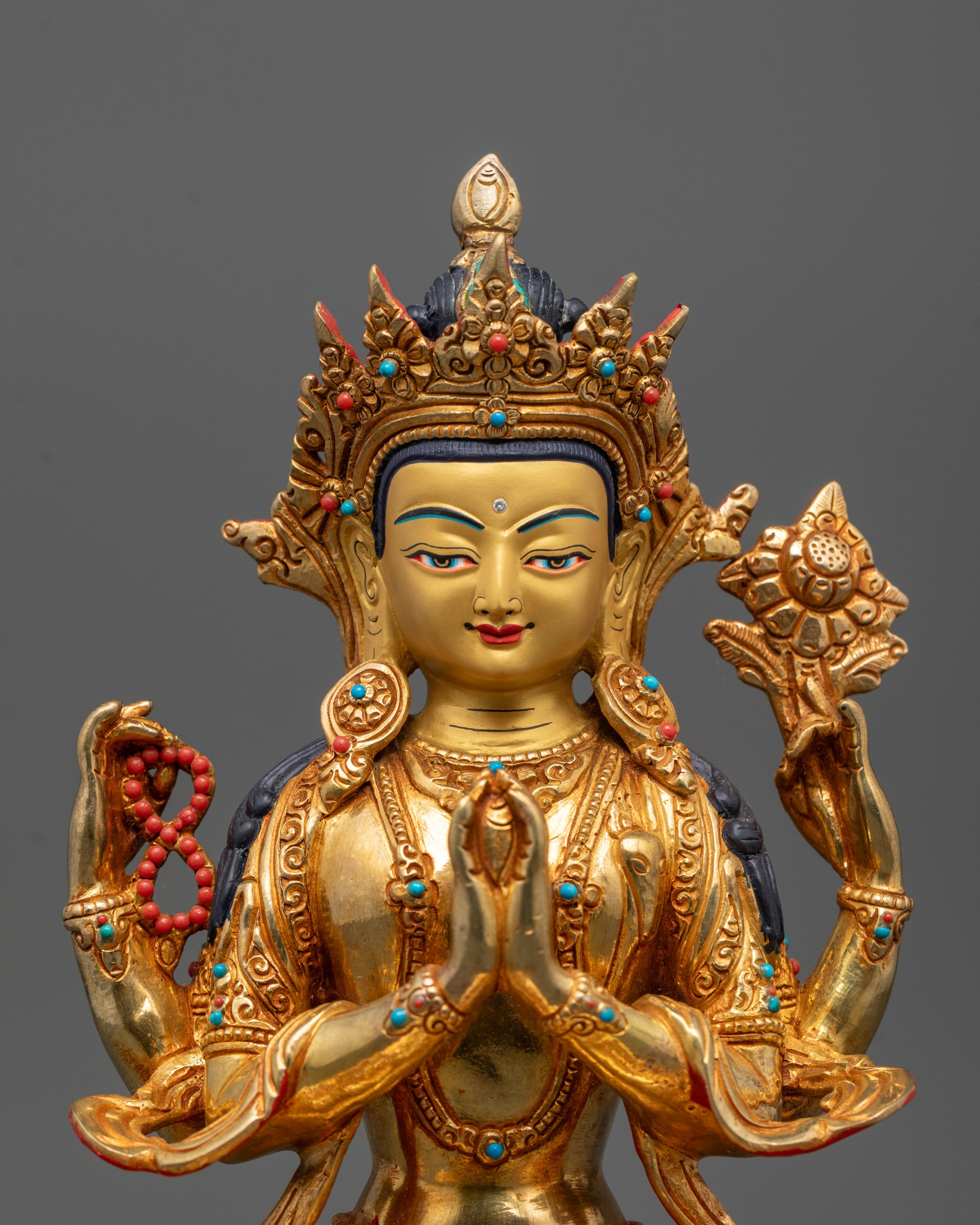 Close-Up of Chenrezig Statue with Acrylic Detailing and Four Arms