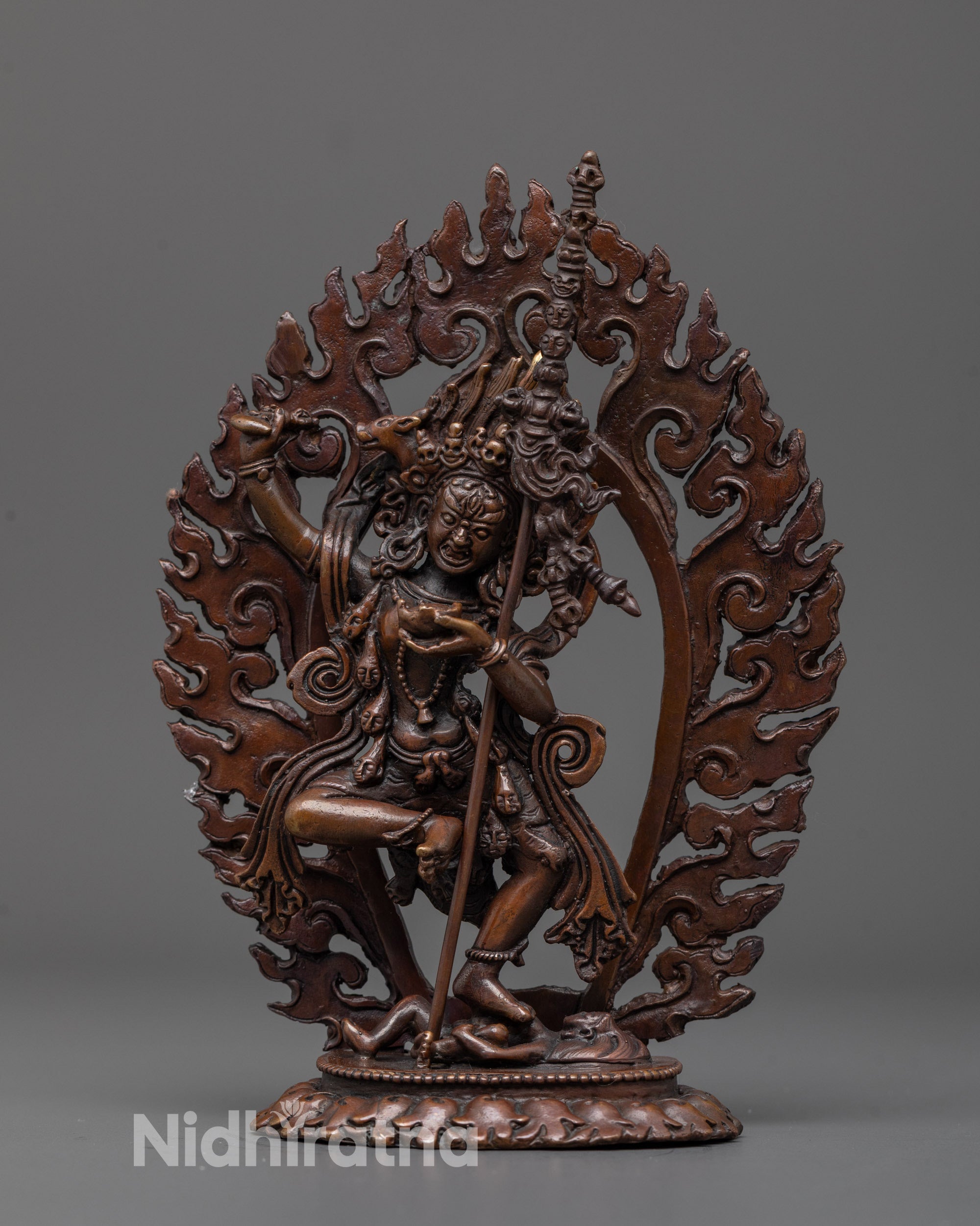 front view of oxidized dorje phagmo statue with khatvanga trident and fierce stance