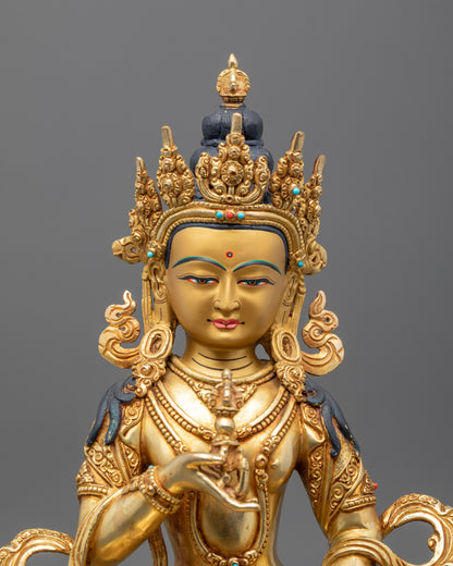 Close-up of Vajrasattva Buddha statue showing 24k fire gold gilded copper