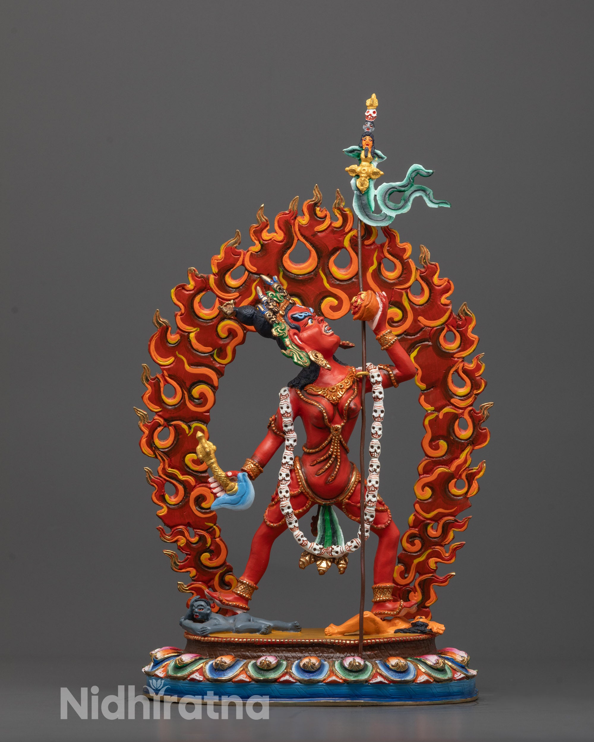 front view of Vajrayogini sculpture with red acrylic and gold detail on copper base