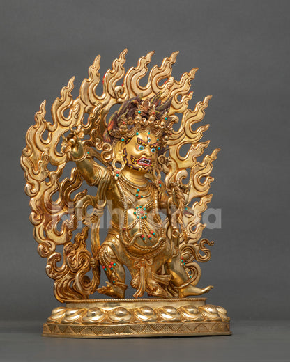 Chana Dorje statue right side view, raised vajra and flaming halo in gold fire-gilded copper
