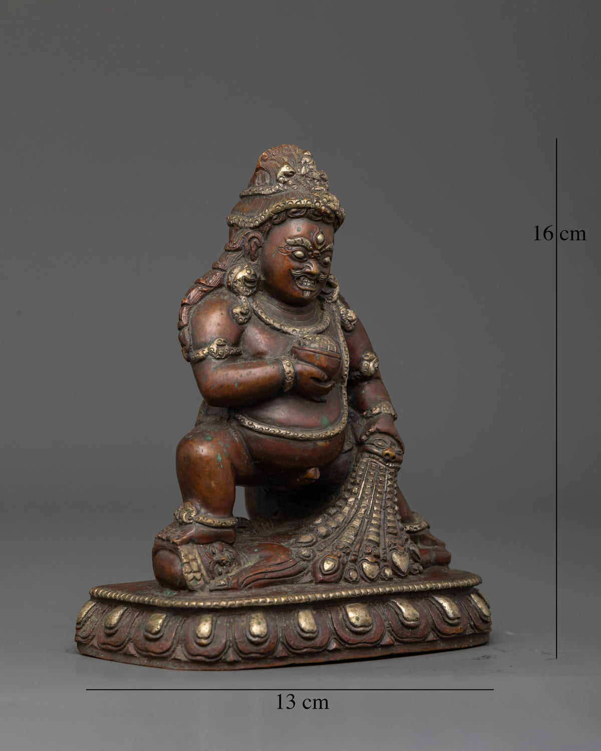 Chemically oxidized Black Dzambhala statue with silver plated finish.