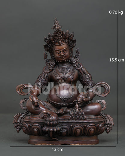 Chemically oxidized copper Dzambhala statue with jewel-spitting mongoose from Nepal.