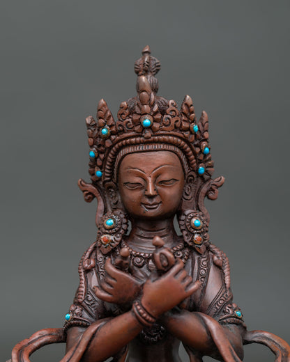 Chemically oxidized vajradhara statue with intricate details and sacred adornments.