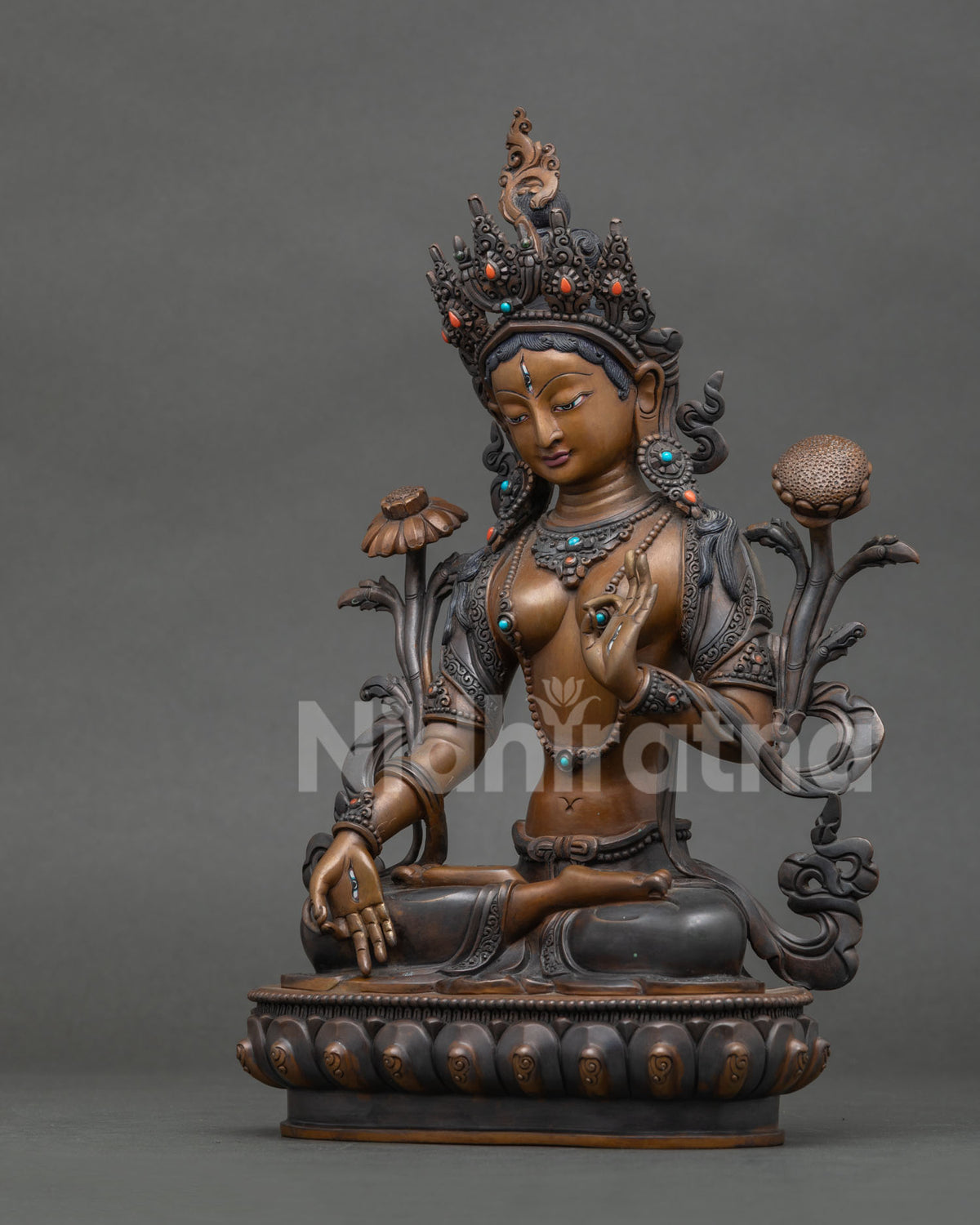 Chemically oxidized White Tara Statue with acrylic painted finish.