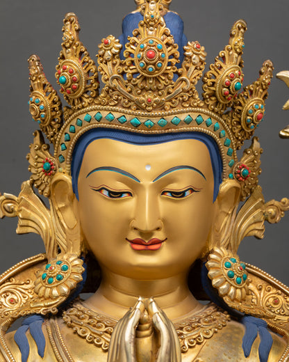 chenrezig face close up avalokiteshvara serene expression gold painted face buddhist statue
