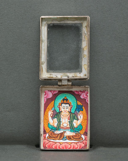 Chenrezig locket miniature four armed thangka hand painted with gold pigments.